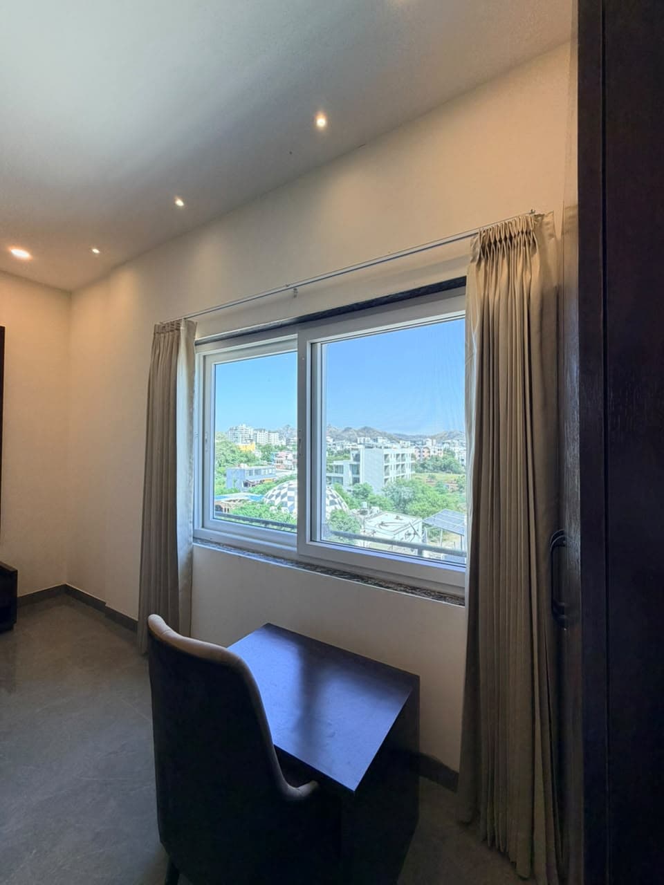 City and hill view from Brick Comfort Room