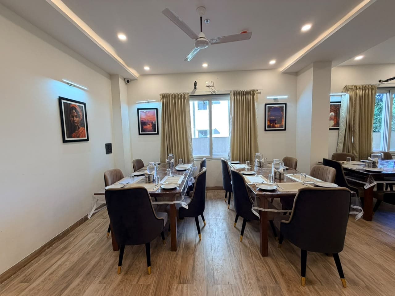Dining tables prepared for guests at the hotel restaurant